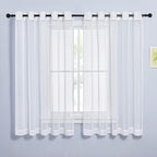 NICETOWN Sheer Curtains for Bedroom Windows 63 inch Length, Grommet Casual Voile Sheer with Light Filter Window Treatments for Living Room, Ivory, 140" Wide Total 2 Panels