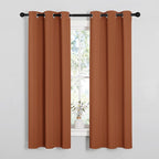 NICETOWN Blackout Curtain Panels for Girls Room, Nursery Essential Thermal Insulated Solid Grommet Top Blackout Drapes (Burnt Orange, 1 Pair, 34 x 63 Inch)