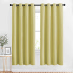 NICETOWN Room Darkening Curtain Panels Grommet - Home Decorations Thermal Insulated Solid Grommet Top Room Darkening Living Room Drapes (Paler Yellow, 1 Pair, 52 x 72-Inch)